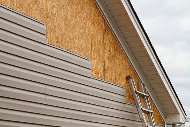 Professional Siding Installation technician working in Churchville, NY